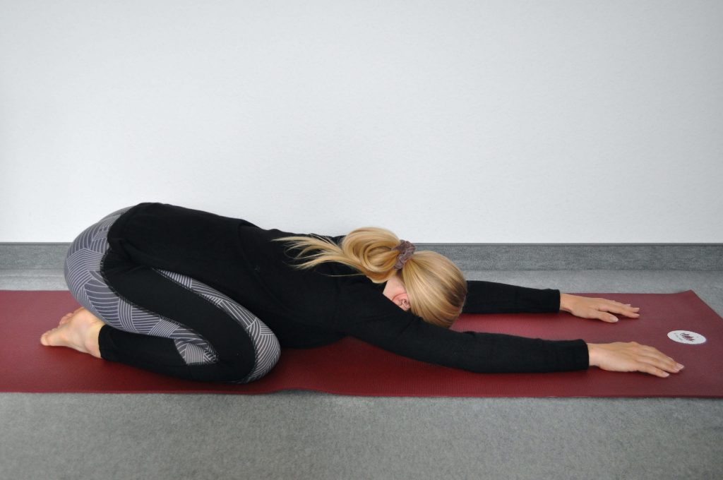 Child's pose Balasana yoga position during menstruation
