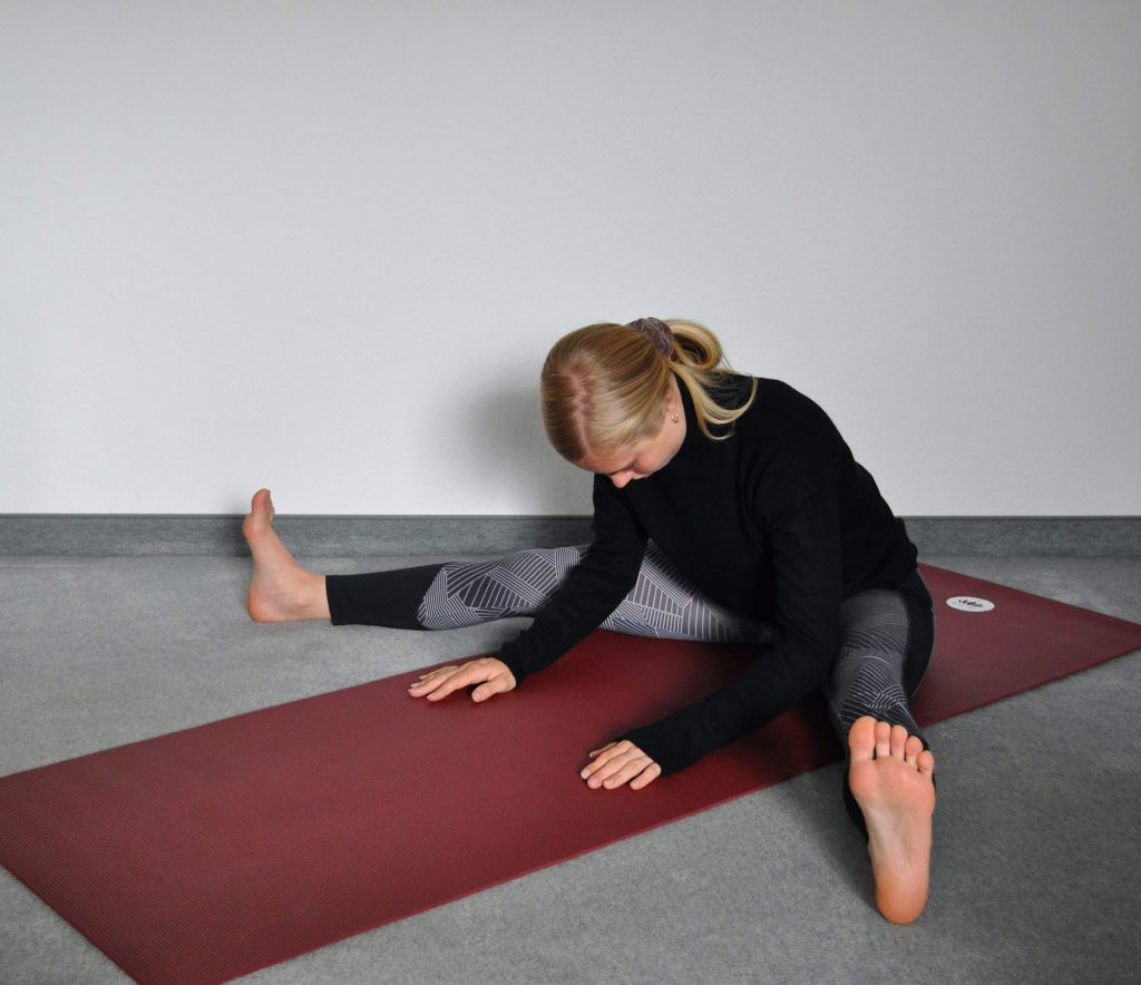 Wide-angle seated forward bend Upavistha Konasana starting position