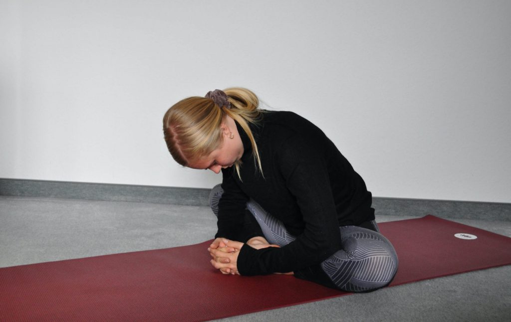 Seated butterfly pose Baddha Konasana upright position
