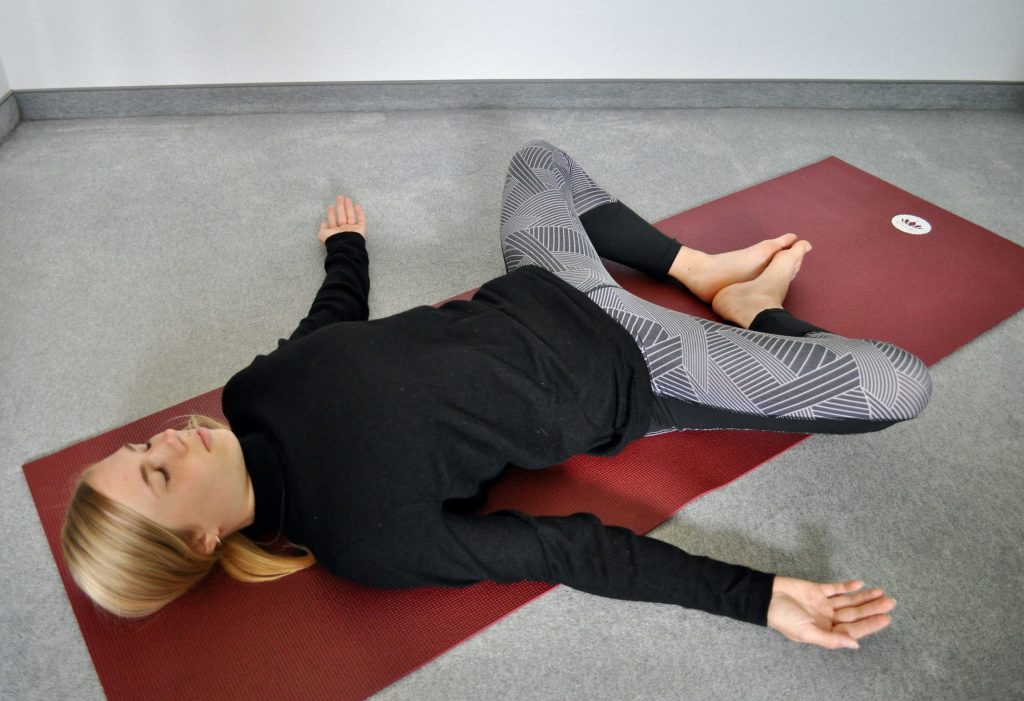 Reclining butterfly pose Supta Baddha Konasana lying down