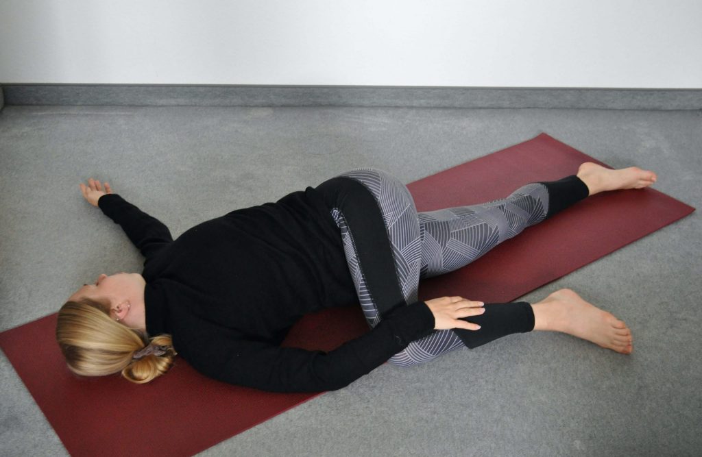 Supine spinal twist Supta Matsyendrasana right side