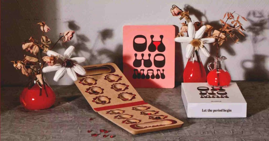 OH WOMAN Spielbox auf buntem Hintergrund in Nahaufnahme