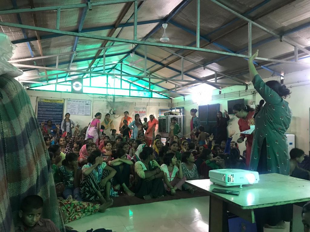 Almas conducting a period awareness workshop in 2019