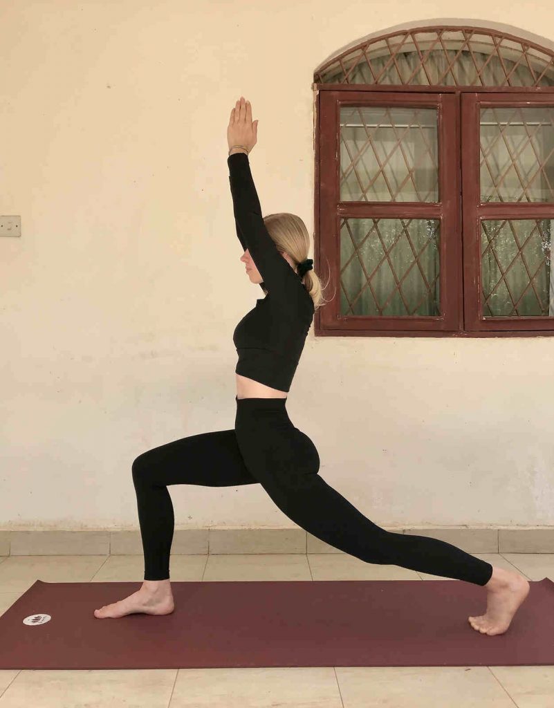 Warrior I (Virabhadrasana) yoga pose for the energetic spring cycle phase